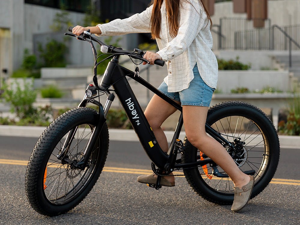 Rider in sandals on a Hiboy P6 fat tire electric bike on a city street