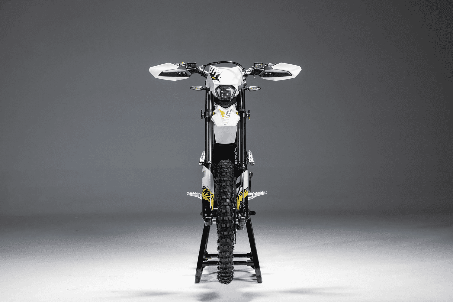 Surron Ultra Bee electric dirt bike Black Edition on a trail
