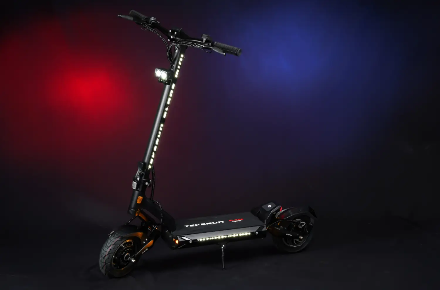 Teverun Blade Mini Pro electric scooter lit up on a black background