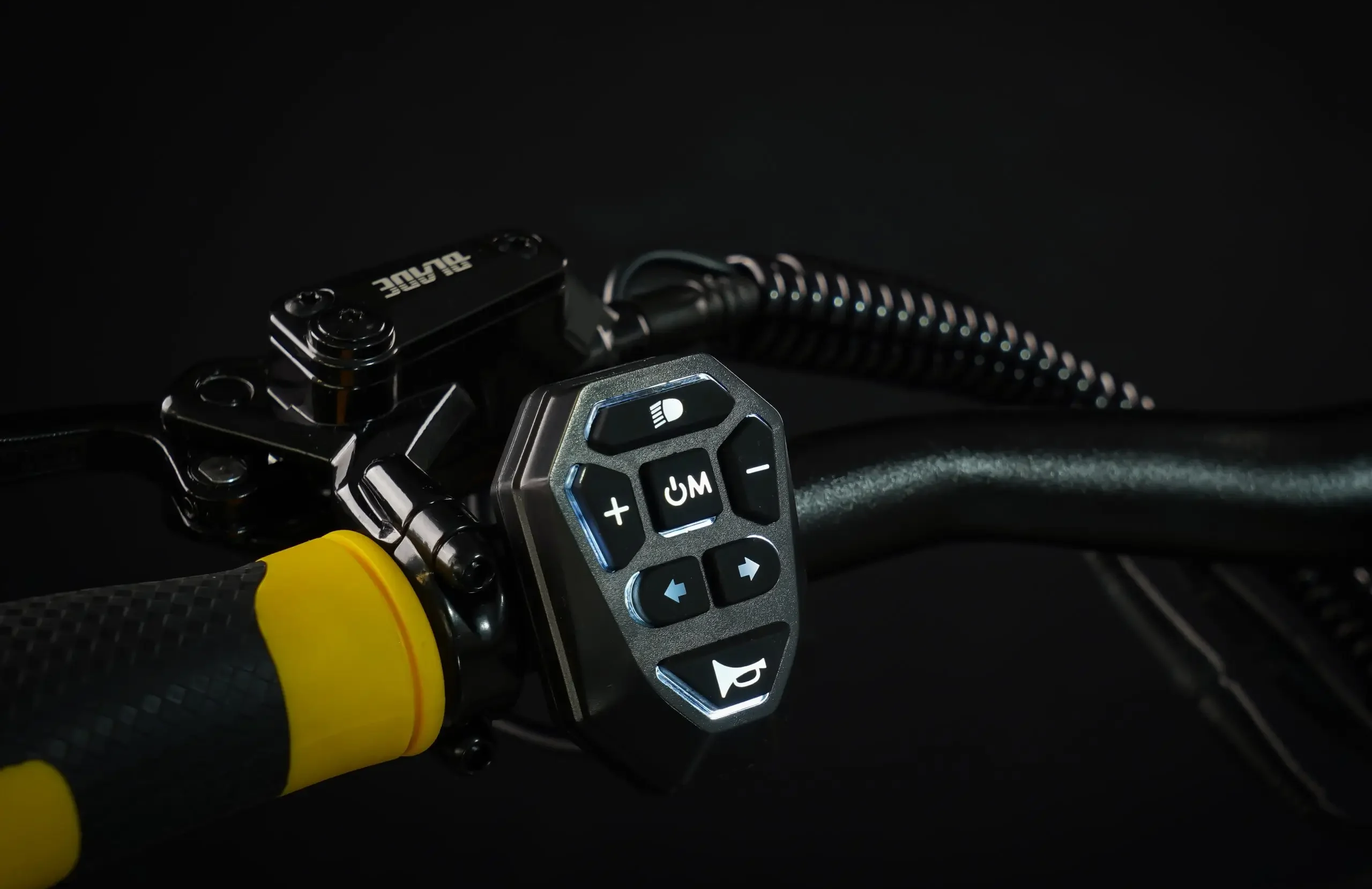Illuminated switch block on the handlebar of the Teverun Blade Mini Ultra electric scooter