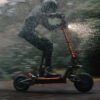 Teverun Fighter Supreme 7260R electric scooter in the rain at night