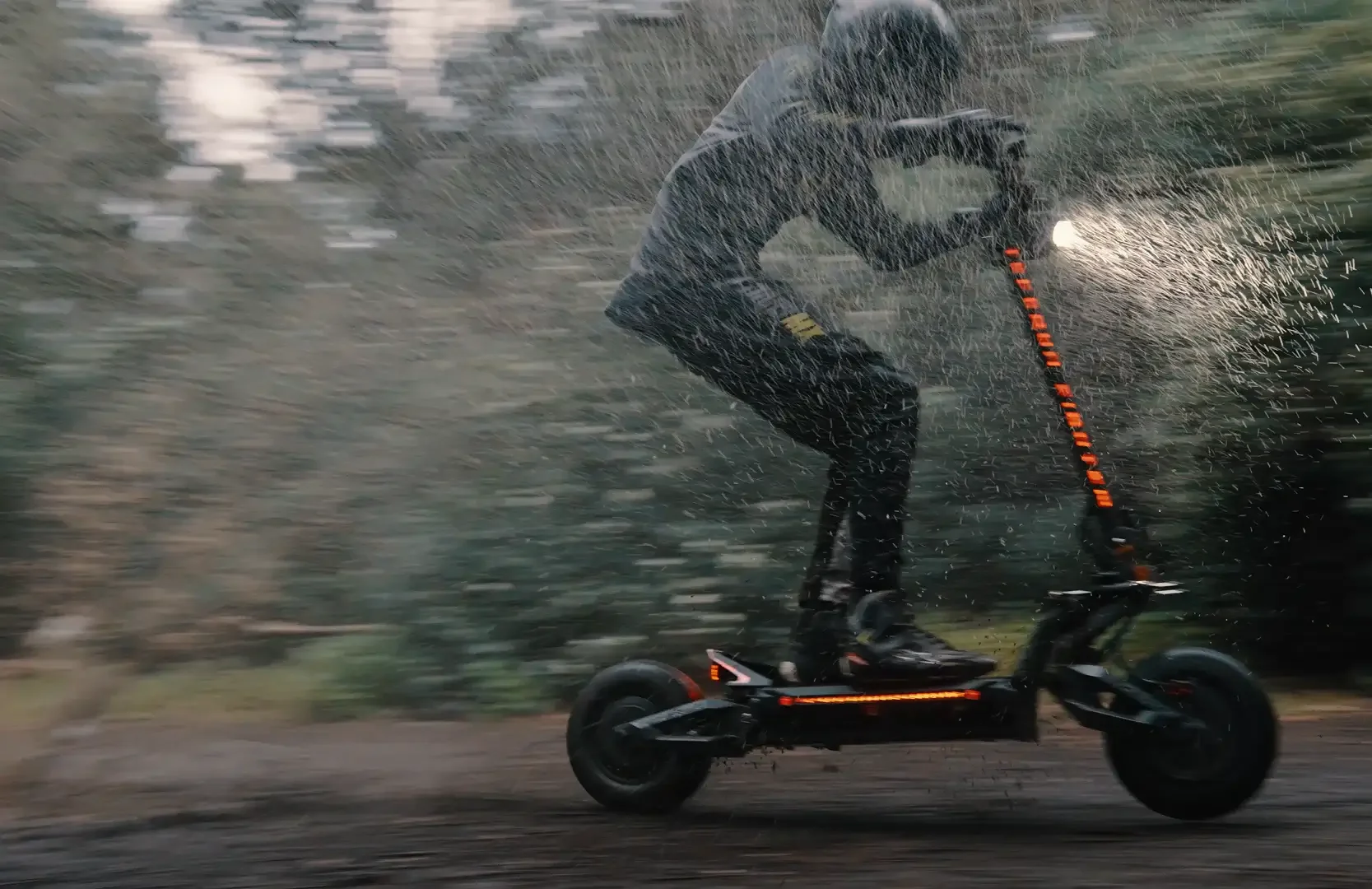 Teverun Fighter Supreme 7260R electric scooter ridden through rain at night