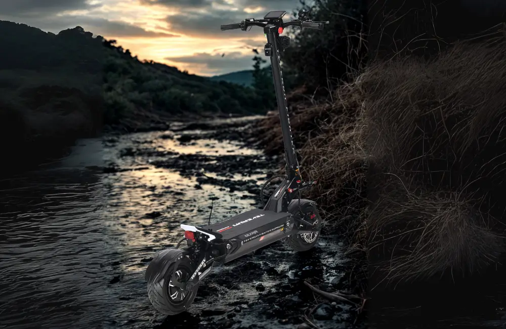 Teverun Fighter Supreme Ultra electric scooter on a riverbed at dusk