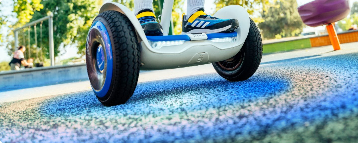 Close-up of a child's feet on the Segway Ninebot S2 Kids self-balancing scooter