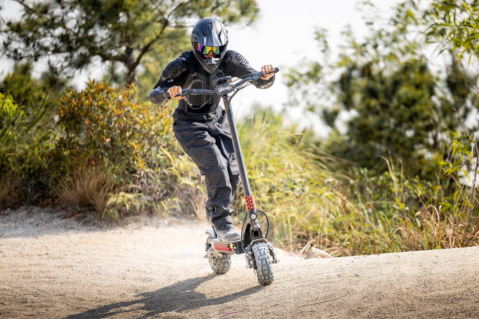 YUME Raptor electric scooter ridden across open terrain