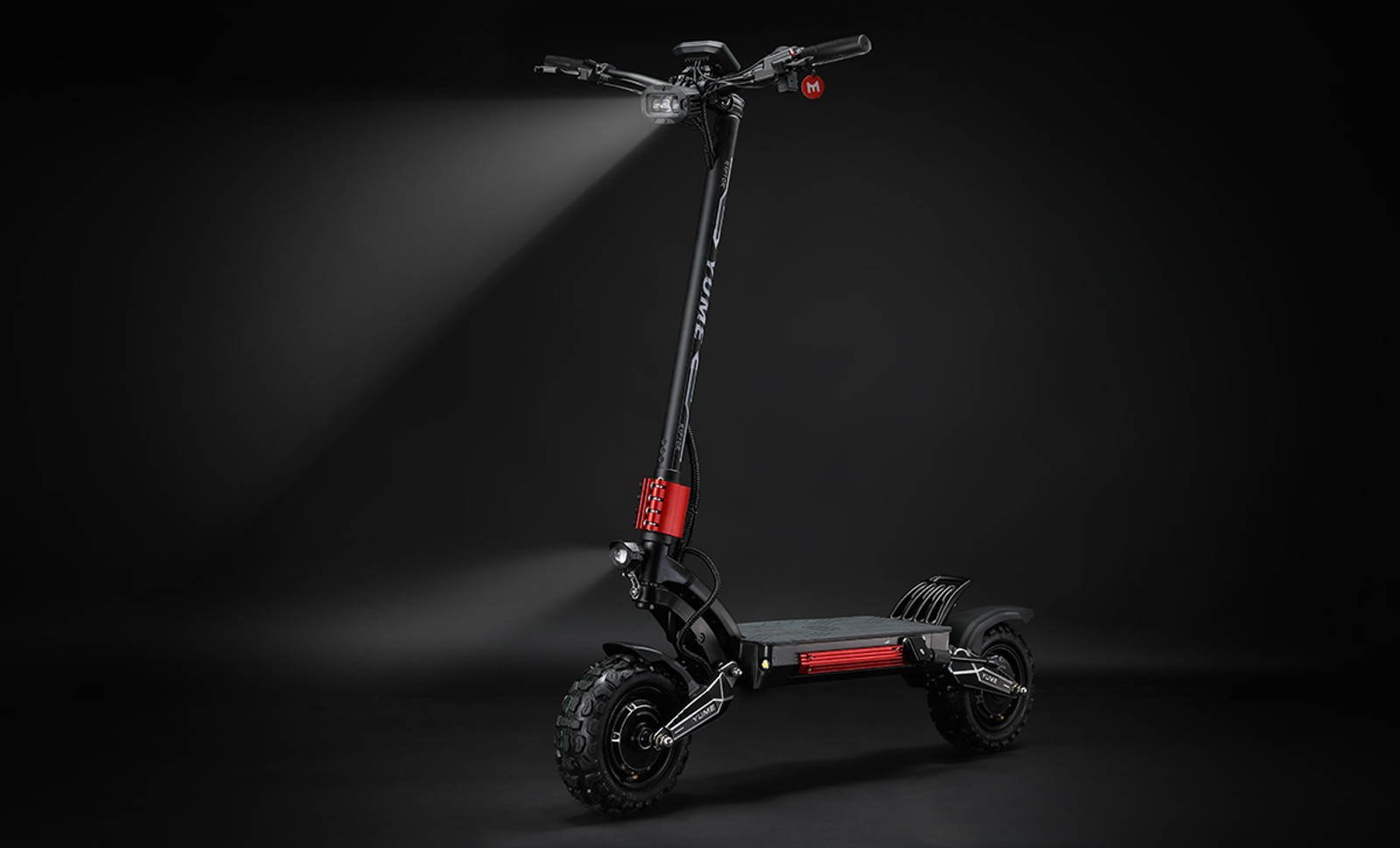YUME Raptor electric scooter dual aluminum headlights lit at night
