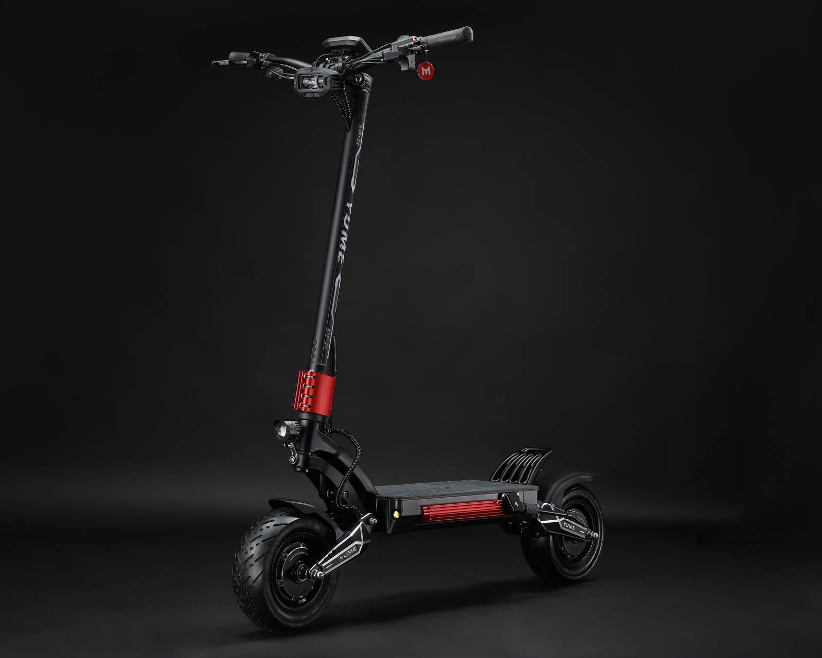 YUME Raptor electric scooter folded into a car trunk