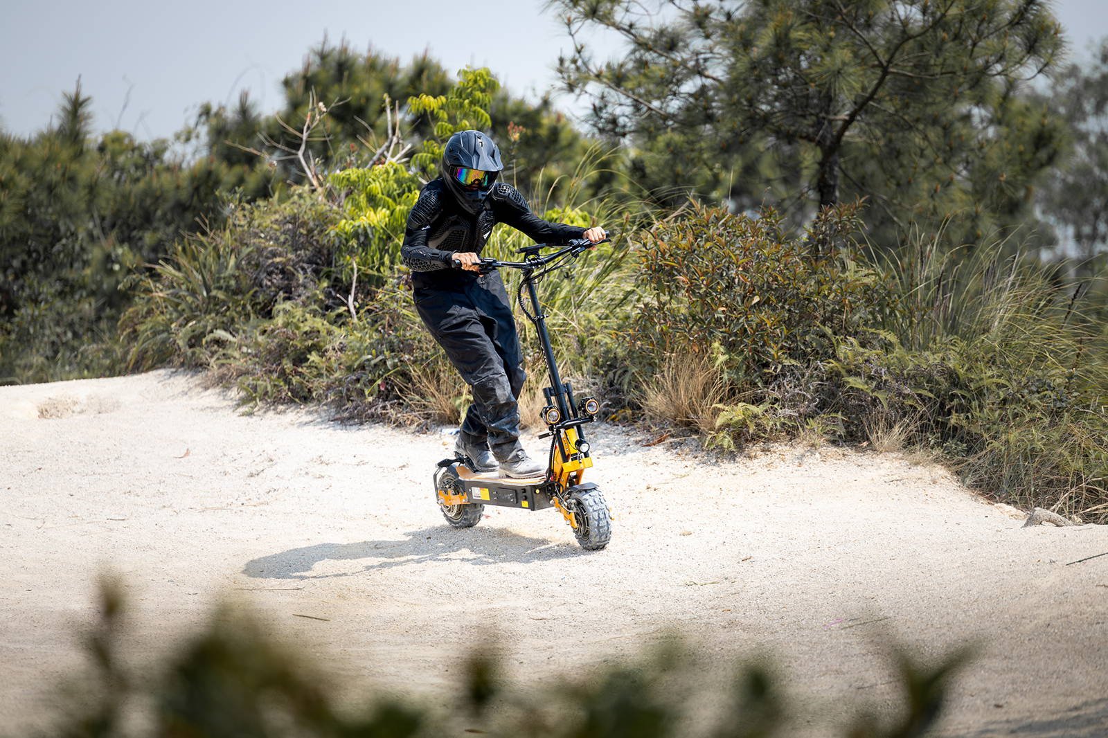 YUME X11+ electric scooter rider on a gravel path